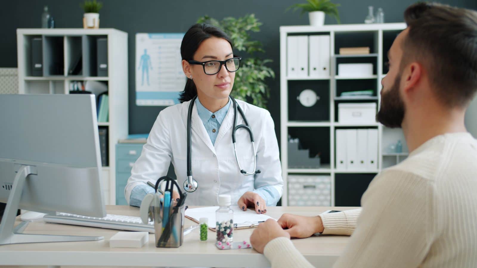 Physician discussing health and weight-loss goals with Physician discussing health and weight-loss goals with a male patient in Greenwich, CT