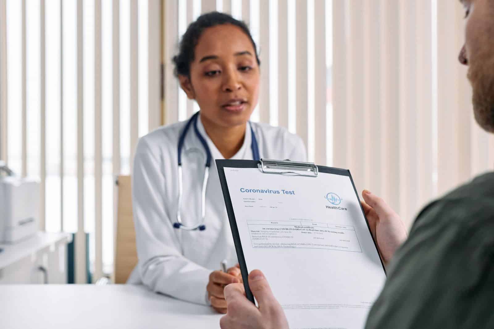 Physician explaining testosterone replacement therapy information to Physician explaining testosterone replacement therapy information to a male patient